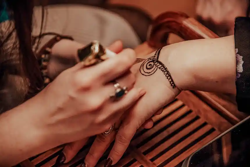 The intimate precision of henna artistry — one line at a time