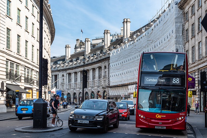 Black cab and red bus, London