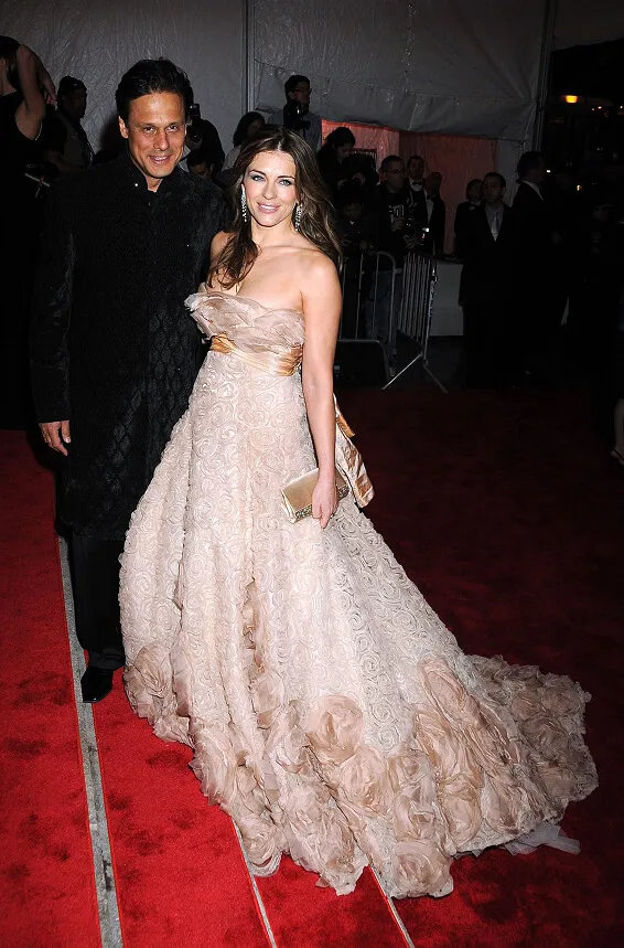 Elizabeth Hurley in an Elie Saab dress, with Arun Nayar
